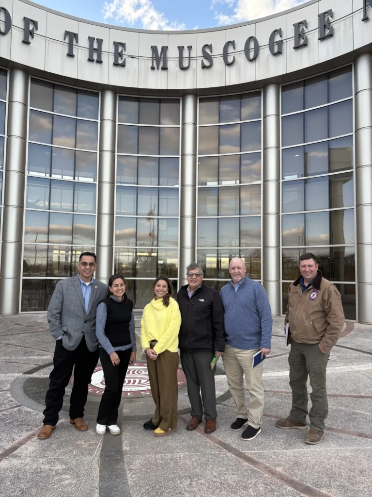 Municipal Investment Fund Kick-Off in Okmulgee, Oklahoma. Group Photo (left to right): 
Second Chief of the Muscogee (Creek) Nation Del Beaver; Adriana Peñuela, COO, cDots; Viviana Alvarez, CEO, cDots; James Williams, Director, Office of Environmental Services Muscogee (Creek) Nation; Jay Hayes, Environmental Specialist, Muscogee (Creek) Nation; Chris Azbell, Workforce Development & Extension Director, College of the Muscogee Nation.